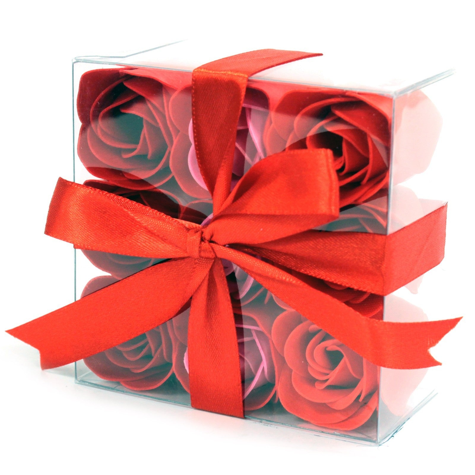 Boite de 9 roses de savon rouge en très gros plan. Noeud d&