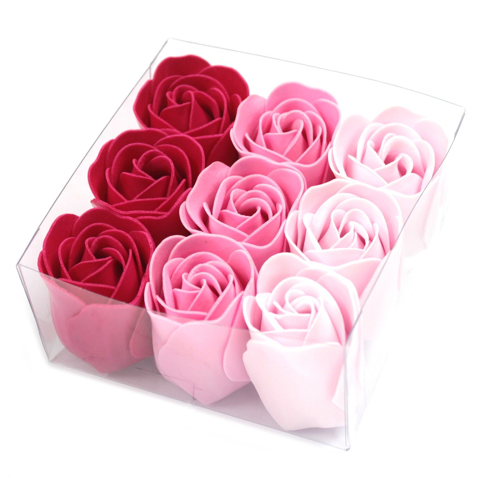 Boite de 9 roses de savon en très gros plan. 3 couleurs différents de nuances de rose.