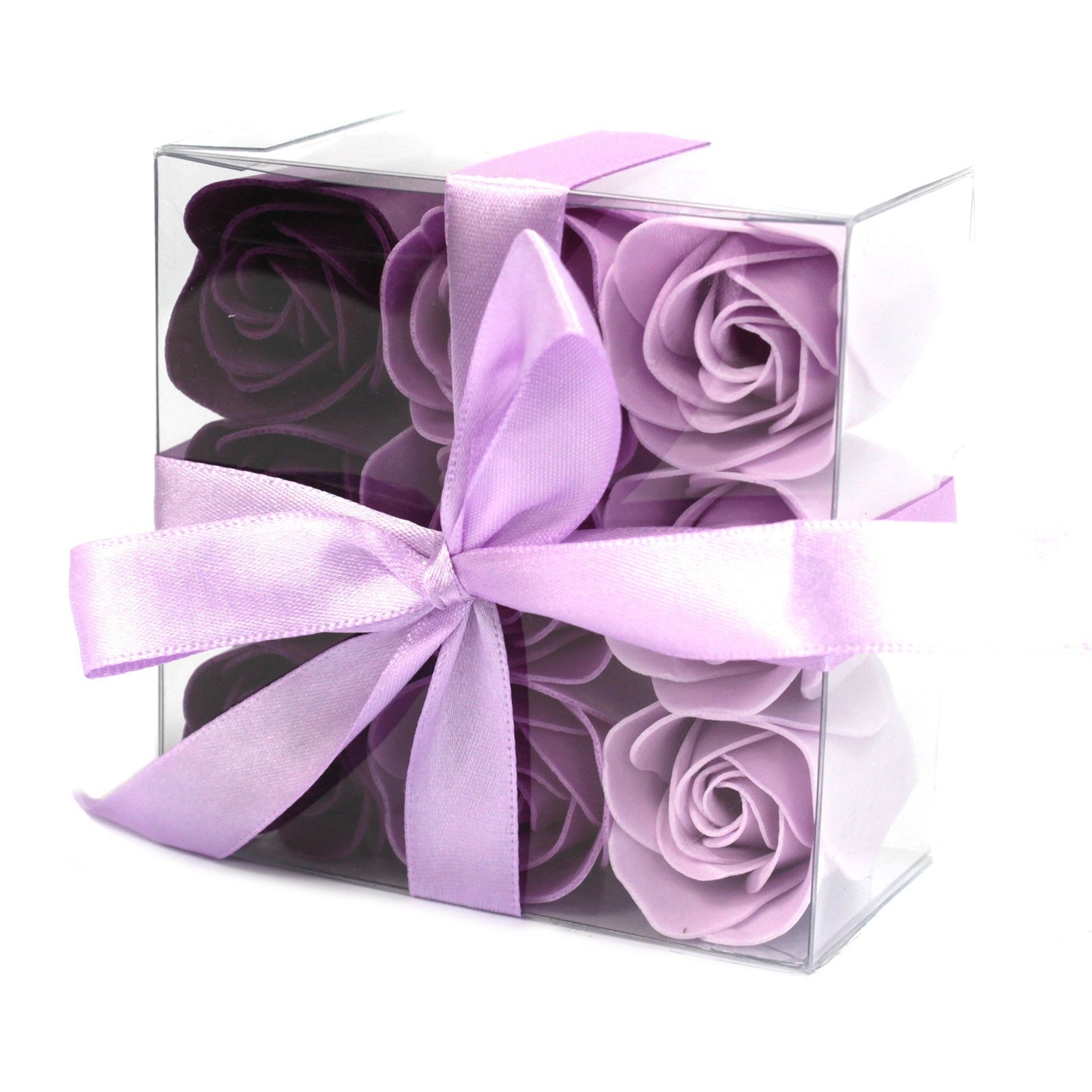 Boite de 9 roses de savon en gros plan. Violet foncé, violet et violet pâle.