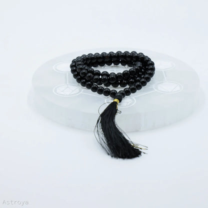 Mala Tourmaline Noire | 8mm sur une pierre de chargement en sélénite disponible sur astroya.fr