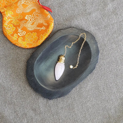 Pendule Quartz rose plaqué laiton avec pochette